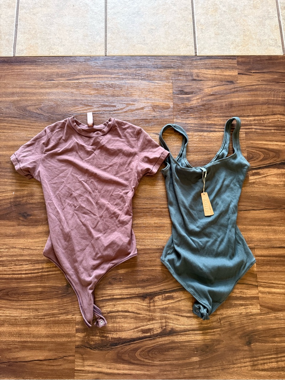 Skims One-Piece Bodysuit in Mauve and Teal . One NWT other barely worn.